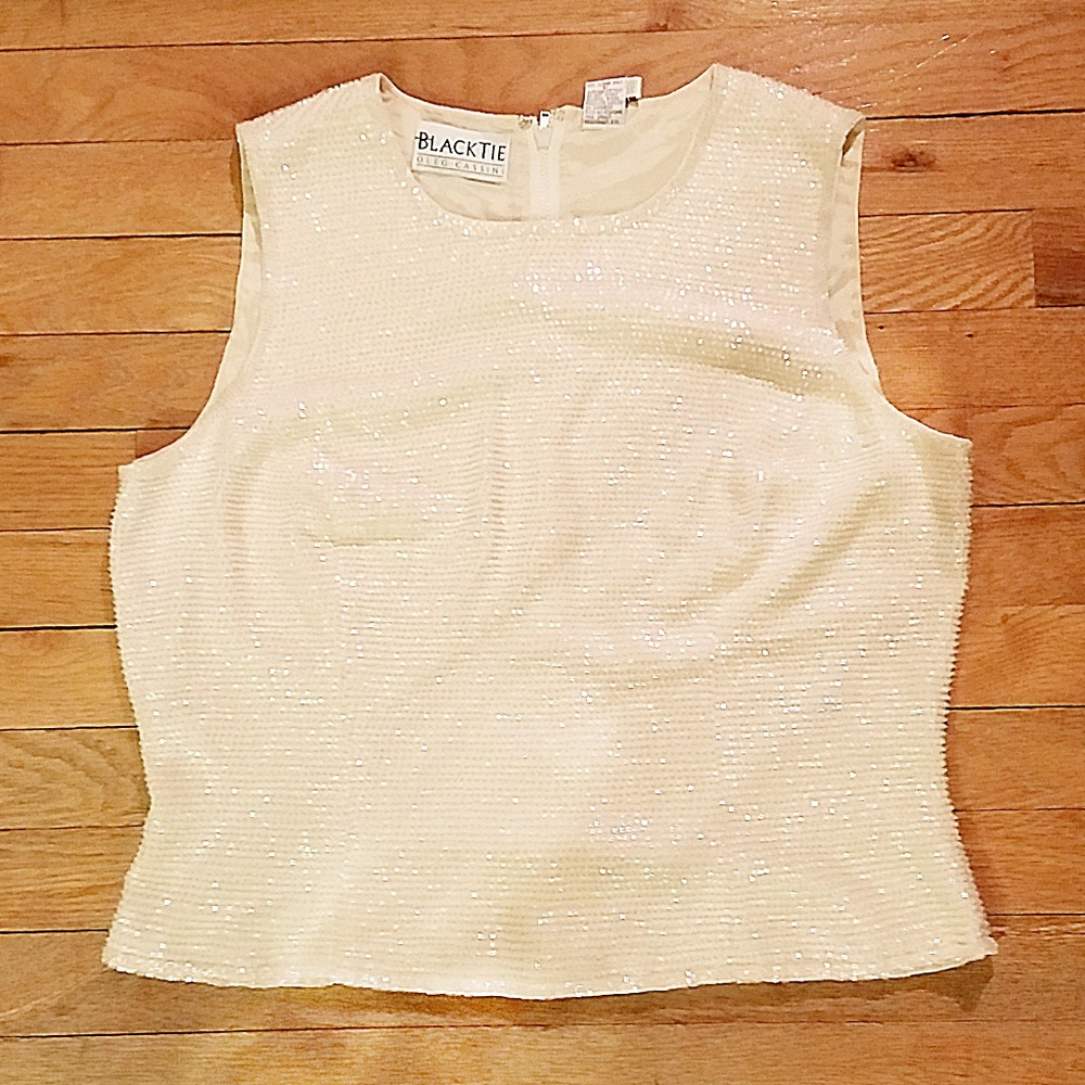 Cropped beaded top. Wear with distressed jeans!